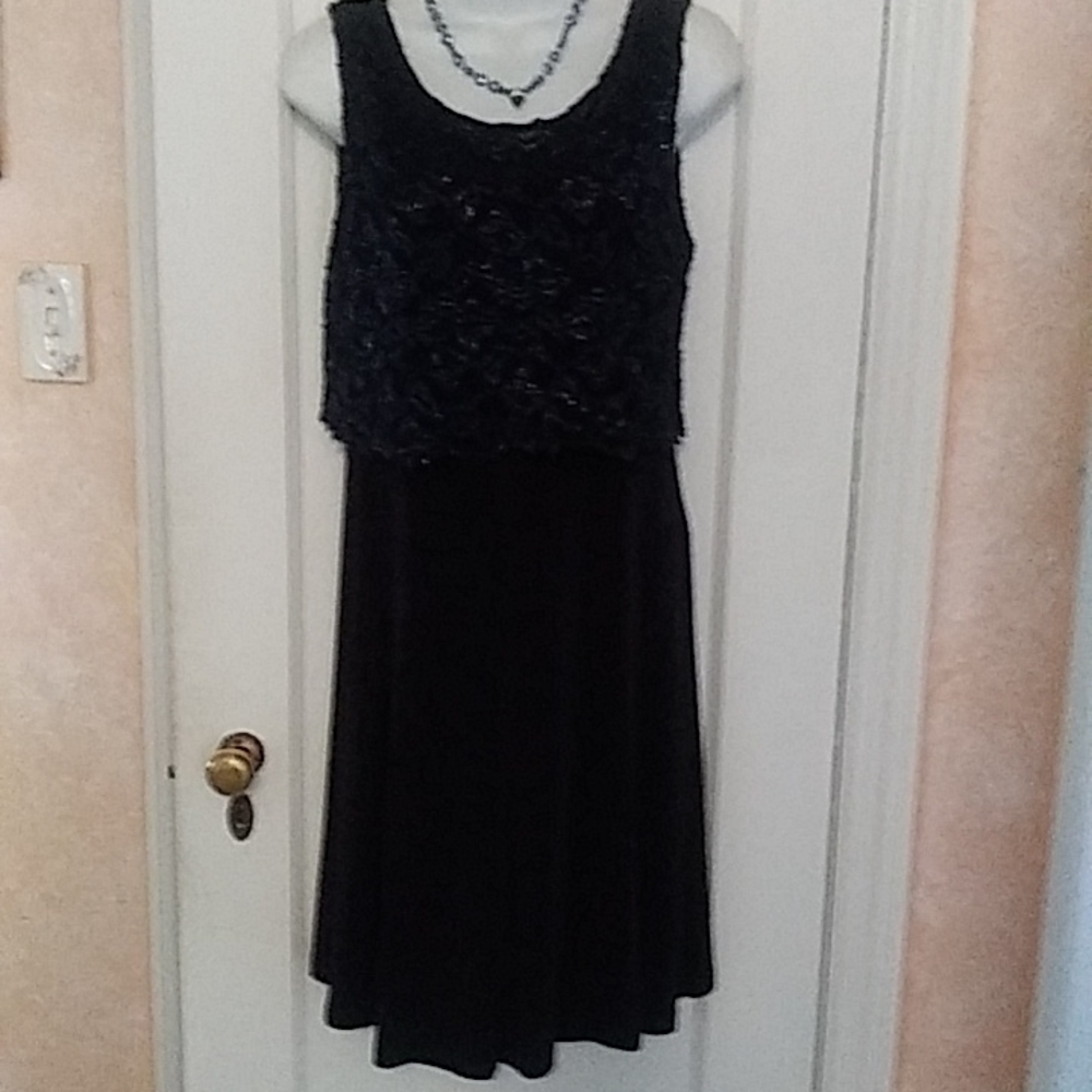 Women's gently worn sleeveless lace bodice dress.